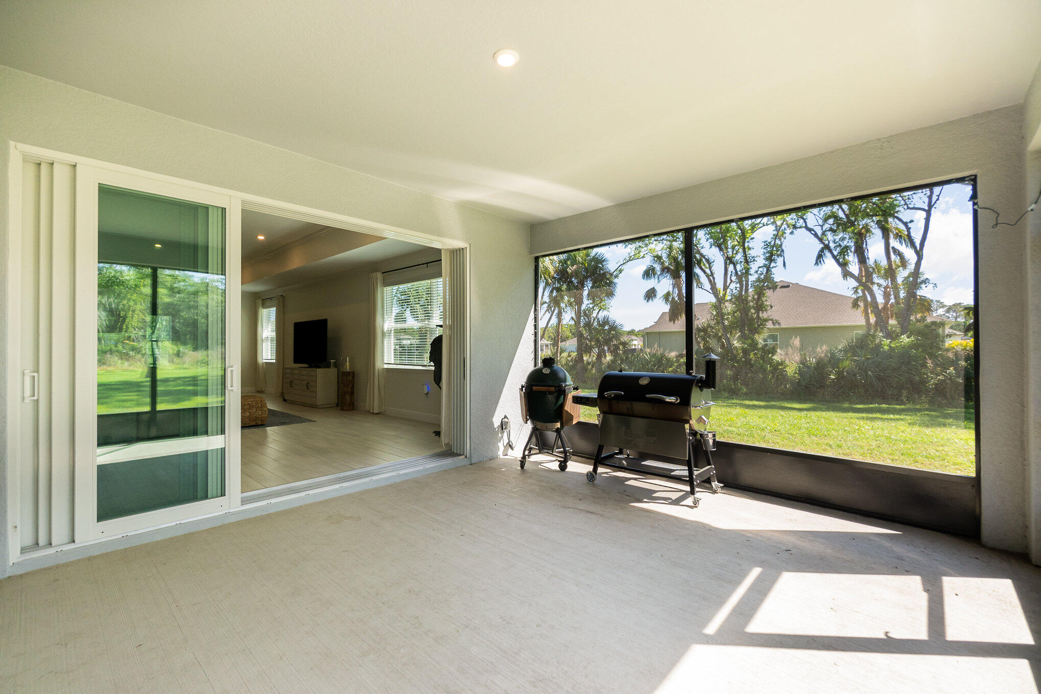 1780 Indria Lane Malabar, FL 32950 - Photo 29 of 35 a view of a room with gym equipment and floor to ceiling window