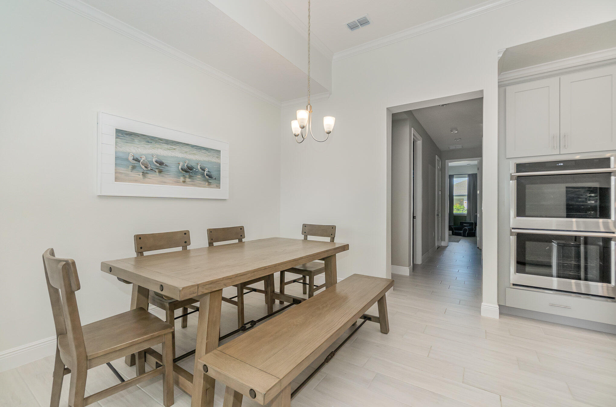 1780 Indria Lane Malabar, FL 32950 - Photo 8 of 35 a view of a dining room with furniture and a chandelier