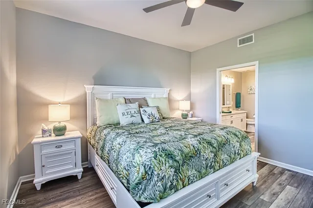 a bedroom with a bed and a ceiling fan