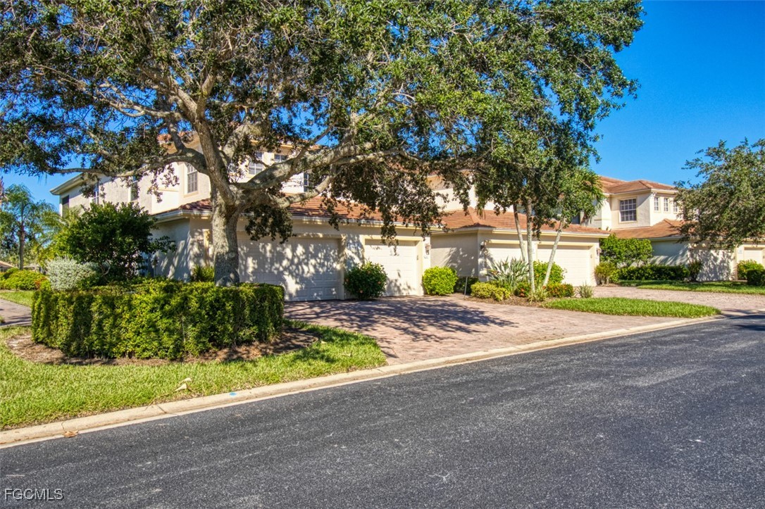 3111 Meandering Way, Unit 101 Fort Myers, FL 33905 - Photo 35 of 50 a view of a yard with plants and trees