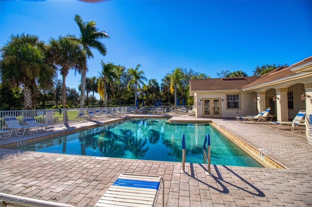 3111 Meandering Way, Unit 101 Fort Myers, FL 33905 - Photo 43 of 50 a view of a house with swimming pool