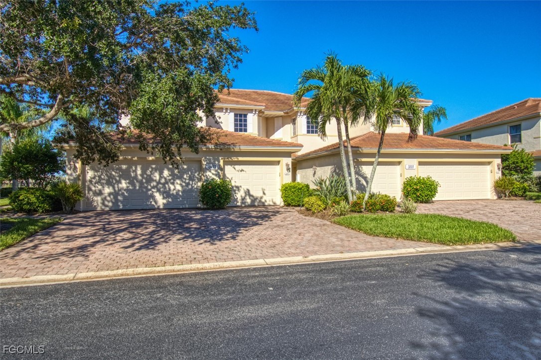 3111 Meandering Way, Unit 101 Fort Myers, FL 33905 - Photo 49 of 50 a view of a house with a street