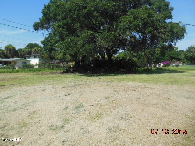 1961 Trimble Road Melbourne, FL 32934 - Photo 14 of 16 a view of outdoor space with deck and trees