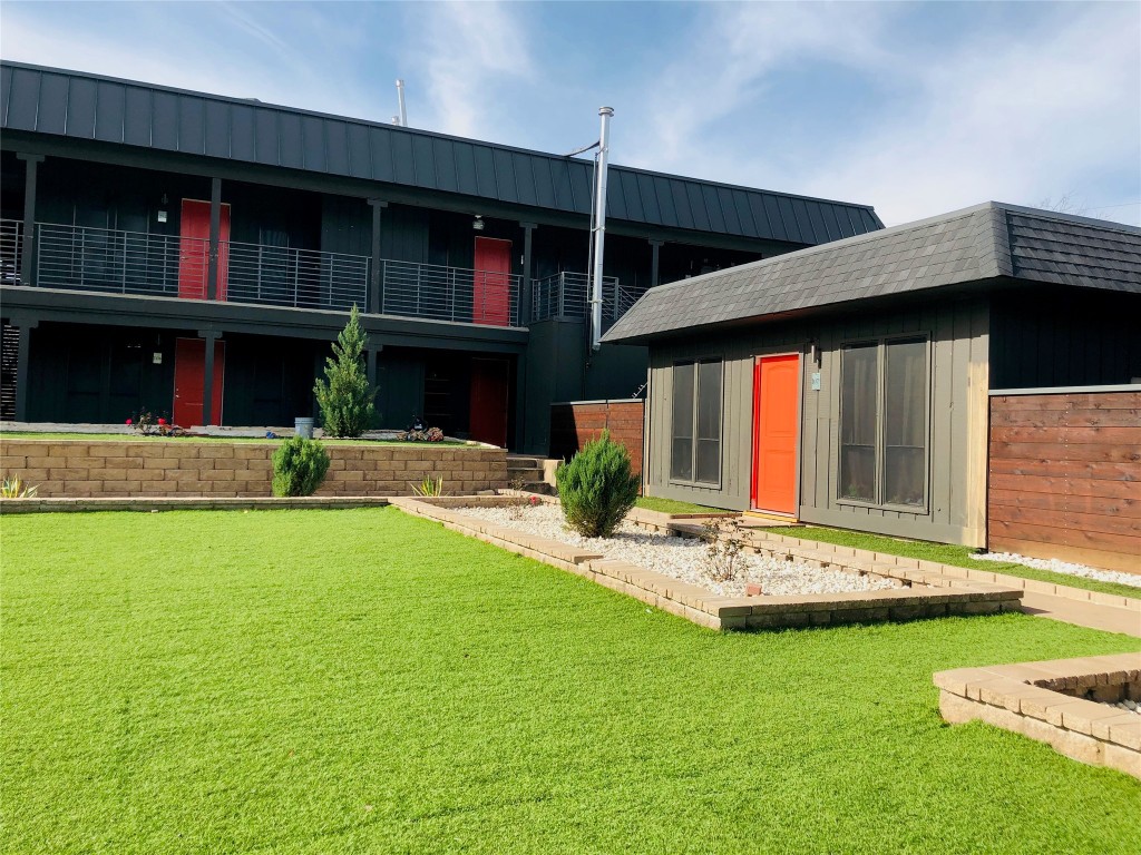 6509 Berkman Drive, Unit 106 Austin, TX 78723 - Photo 2 of 17 a front view of house with yard