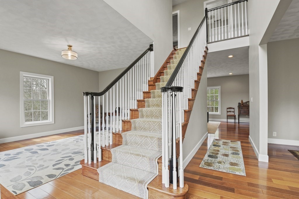 25 Wilkes Road Rowley, MA 01969 - Photo 3 of 40 a view of entryway and hall with wooden floor