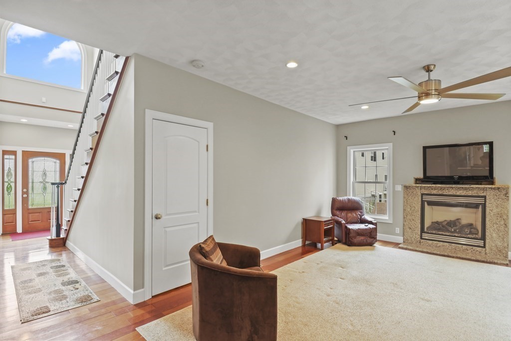 25 Wilkes Road Rowley, MA 01969 - Photo 7 of 40 a living room with furniture and a flat screen tv