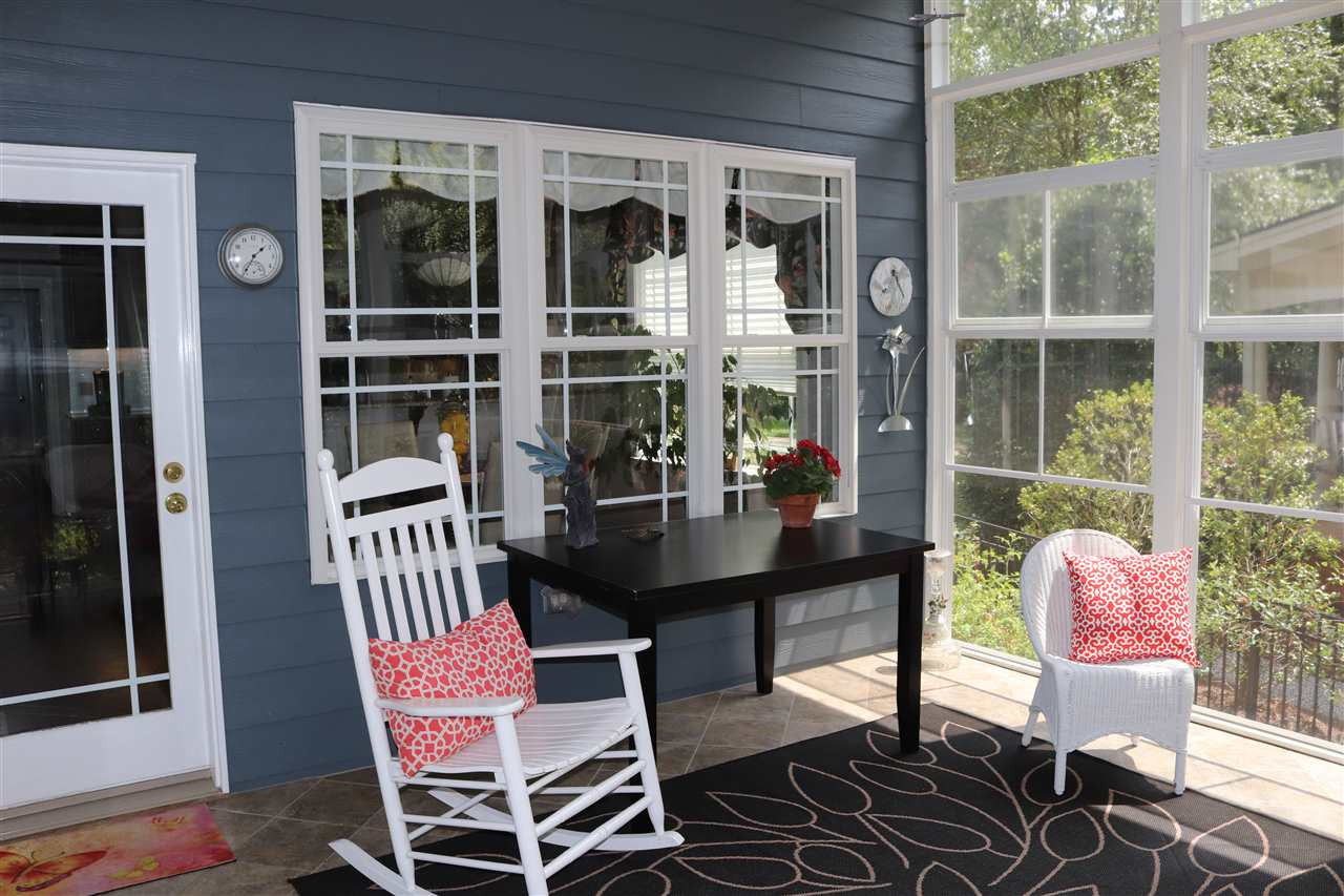 8119 Dreamy Way Raleigh, NC 27613 - Photo 12 of 30 Screened porch is perfect for all seasons. Right out the breakfast room door! Screened porch