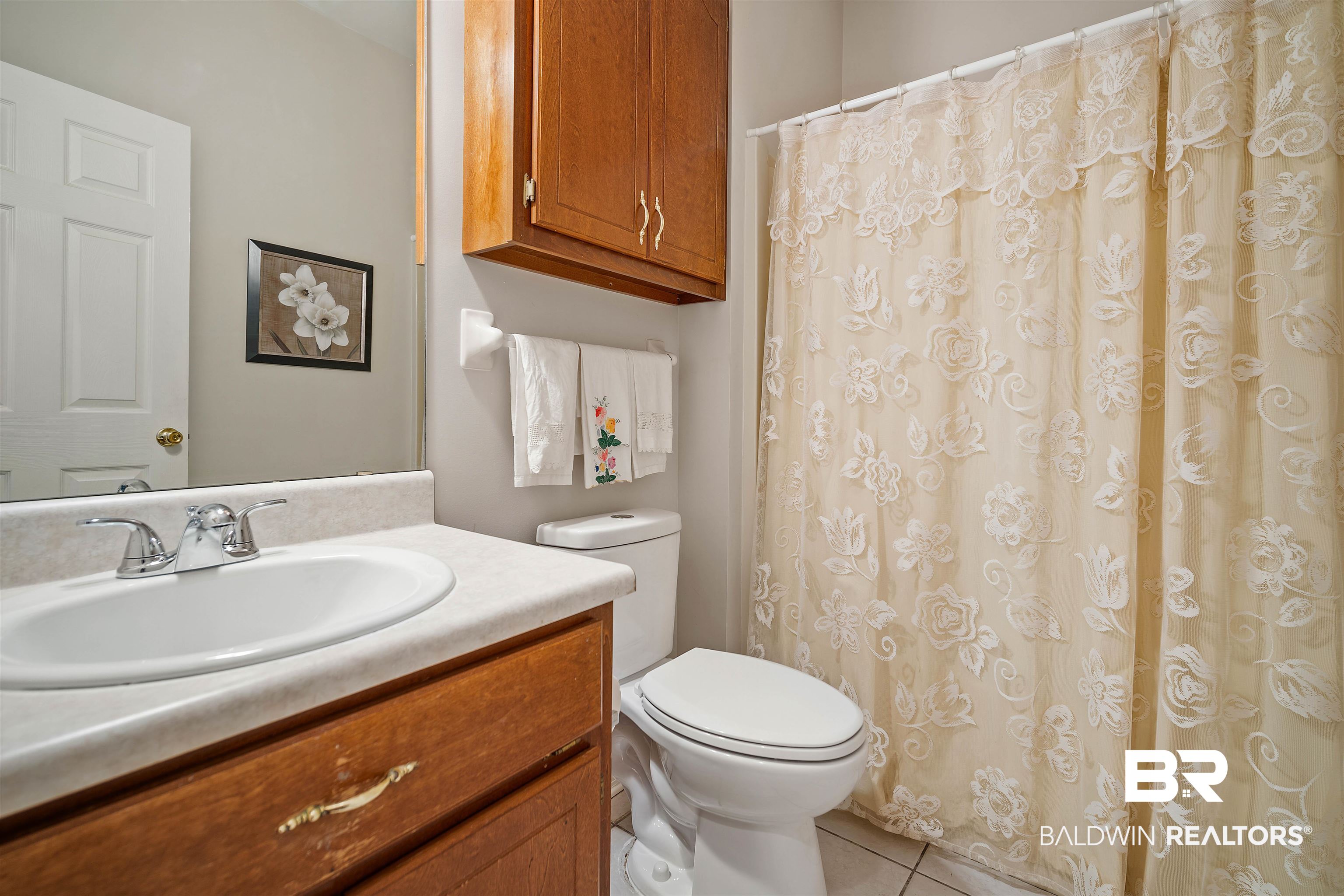 7419 Pake Road Saraland, AL 36571 - Photo 19 of 27 Bathroom with tile patterned floors, vanity, and toilet