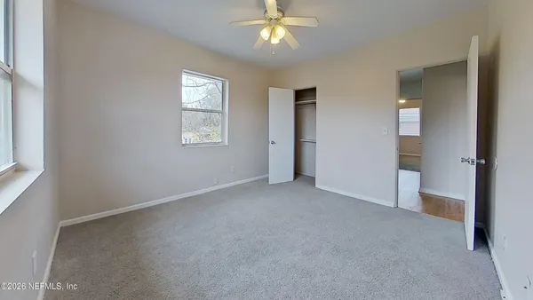 a view of an empty room with a window