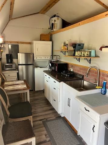 766 Monroe Floyd Road Decherd, TN 37324 - Photo 4 of 8 a kitchen with stainless steel appliances a stove a microwave and a refrigerator