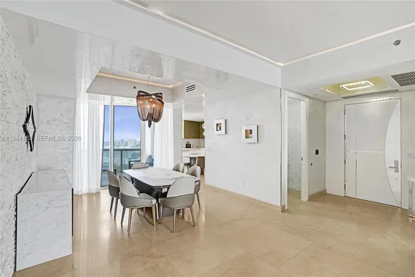 a kitchen with kitchen island a sink stainless steel appliances and cabinets