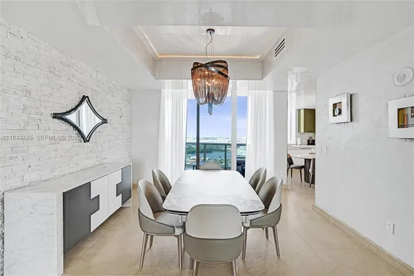 a spacious bathroom with a sink a large mirror and a shower