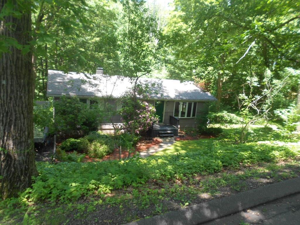 26 Mamanasco Road Ridgefield, CT 06877 - Photo 1 of 1 a view of house with yard and outdoor seating