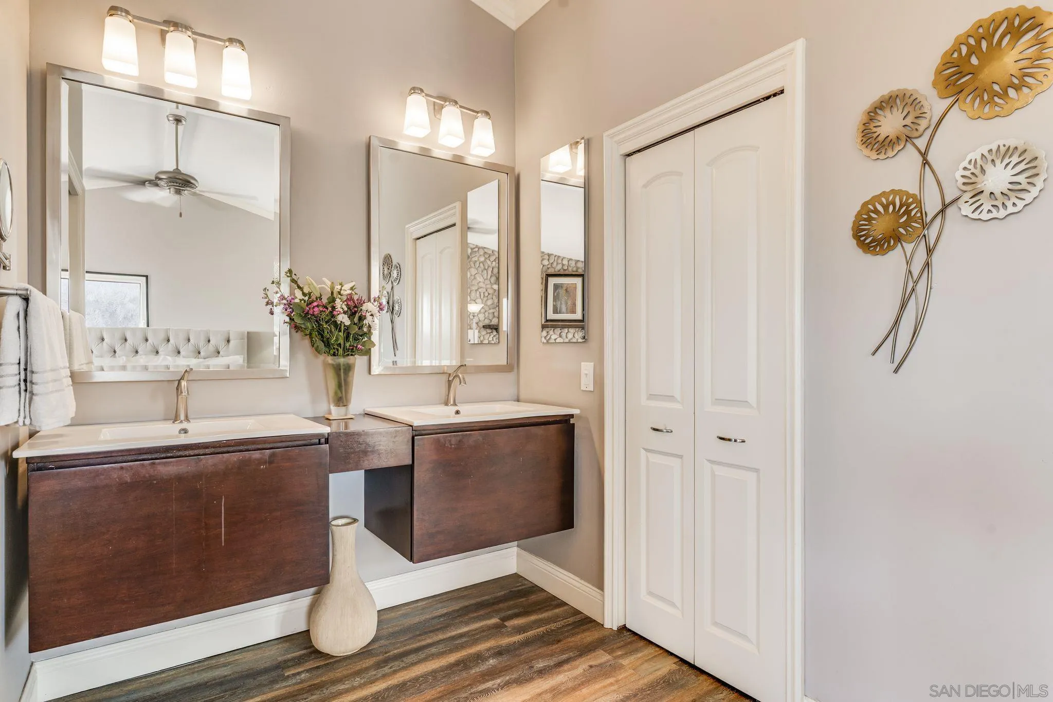 818 Genter Street La Jolla, CA 92037 - Photo 16 of 26 a spacious bathroom with a tub sink and mirror