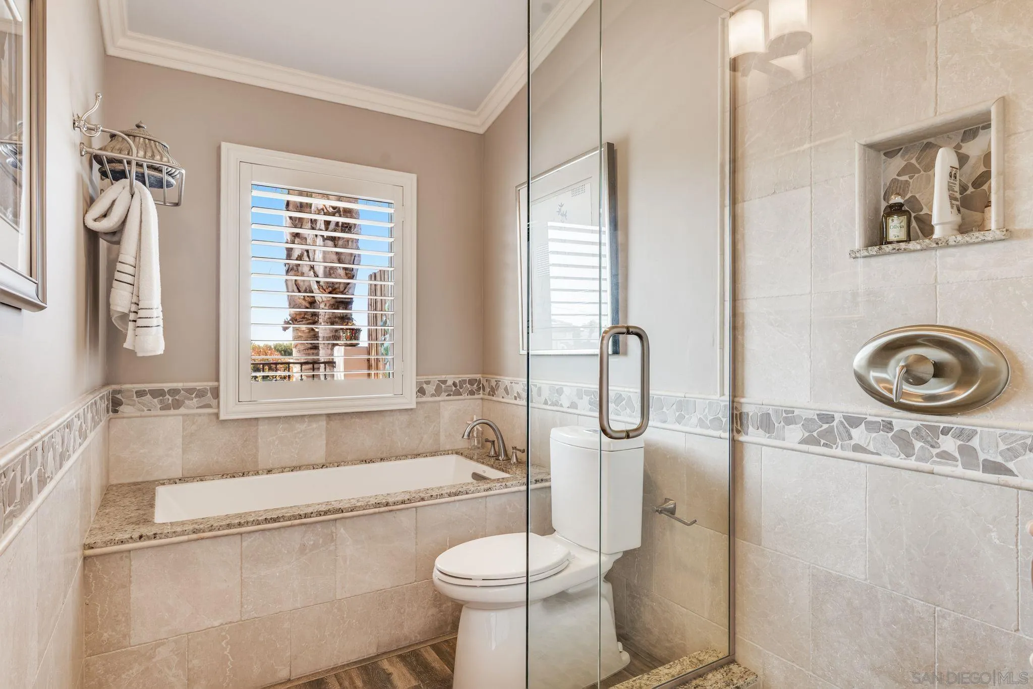 818 Genter Street La Jolla, CA 92037 - Photo 17 of 26 a bathroom with a toilet sink and mirror