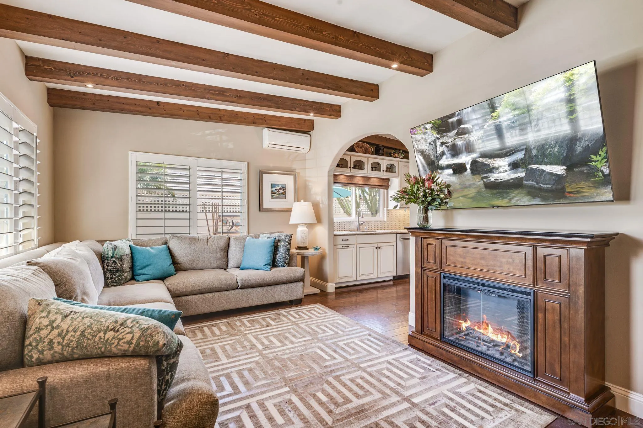 818 Genter Street La Jolla, CA 92037 - Photo 2 of 26 a living room with furniture and a fireplace
