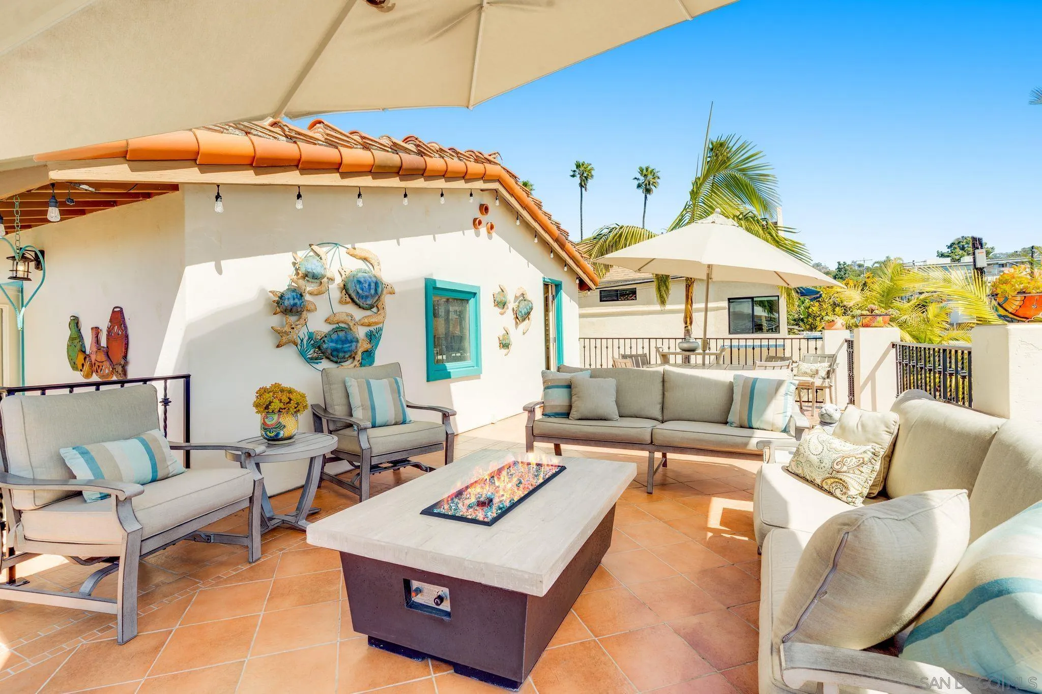818 Genter Street La Jolla, CA 92037 - Photo 21 of 26 a living room with furniture and a chandelier
