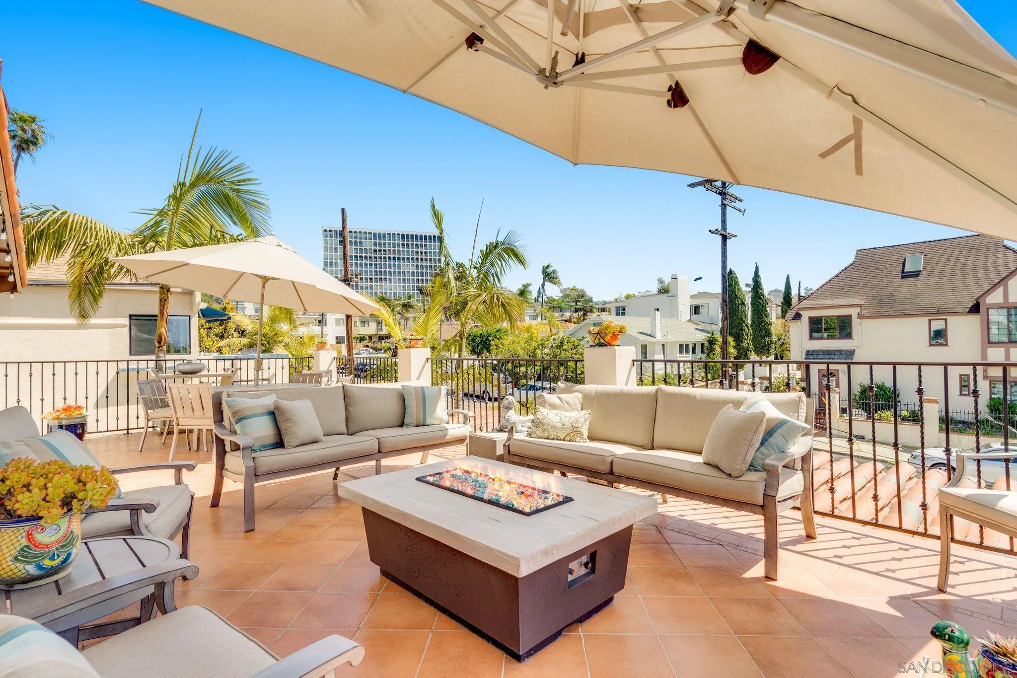 818 Genter Street La Jolla, CA 92037 - Photo 23 of 26 a living room with furniture ceiling fan and a rug