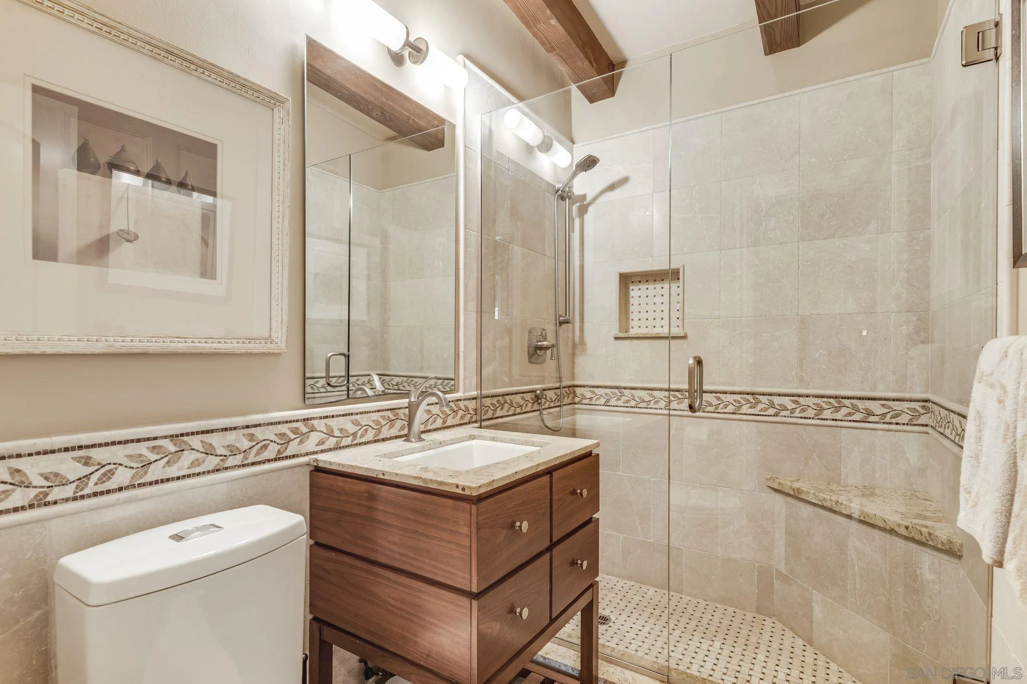 818 Genter Street La Jolla, CA 92037 - Photo 10 of 26 a bathroom with a granite countertop sink a toilet a mirror and shower