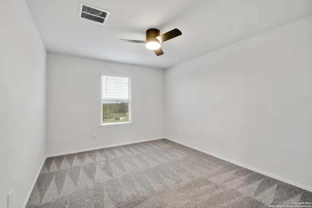 a bathroom with a bathtub shower sink vanity and a mirror