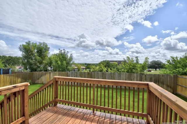 a view of a yard with a trampoline