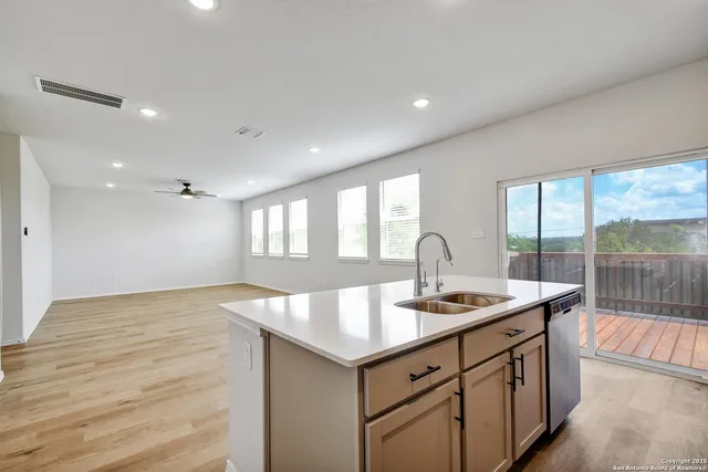 a kitchen with sink and window