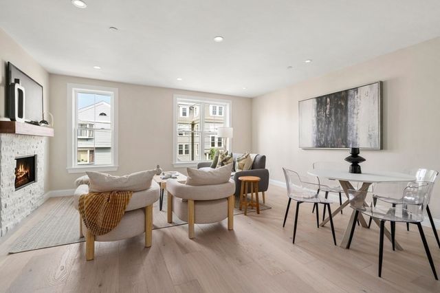 a view of a livingroom with furniture and a fireplace