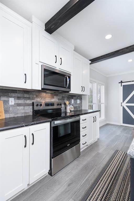 1895 County Road 472 Rochelle, TX 76872 - Photo 6 of 39 a kitchen with granite countertop white cabinets white stainless steel appliances and a sink