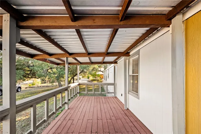 a view of porch with wooden floor