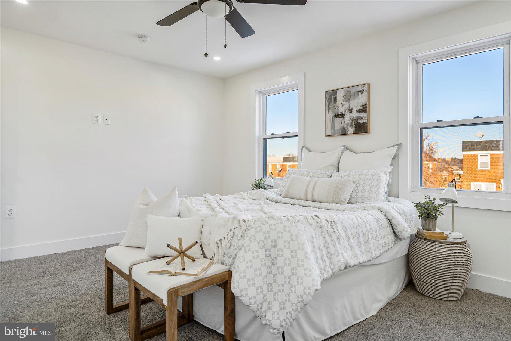 3925 Chesterfield Avenue Baltimore, MD 21213 - Photo 23 of 35 a bedroom with a bed and a table