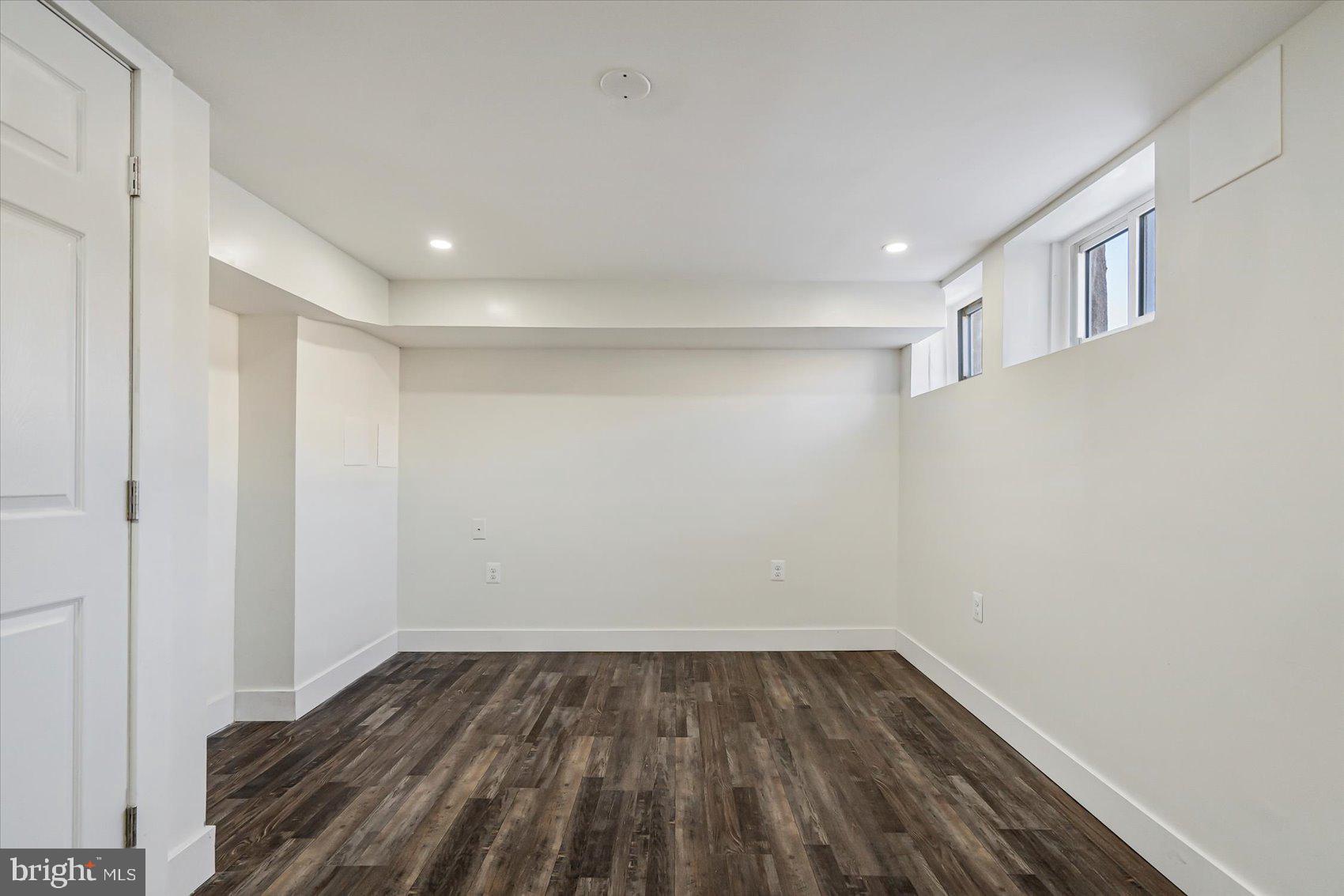 3925 Chesterfield Avenue Baltimore, MD 21213 - Photo 31 of 35 a view of empty room with wooden floor
