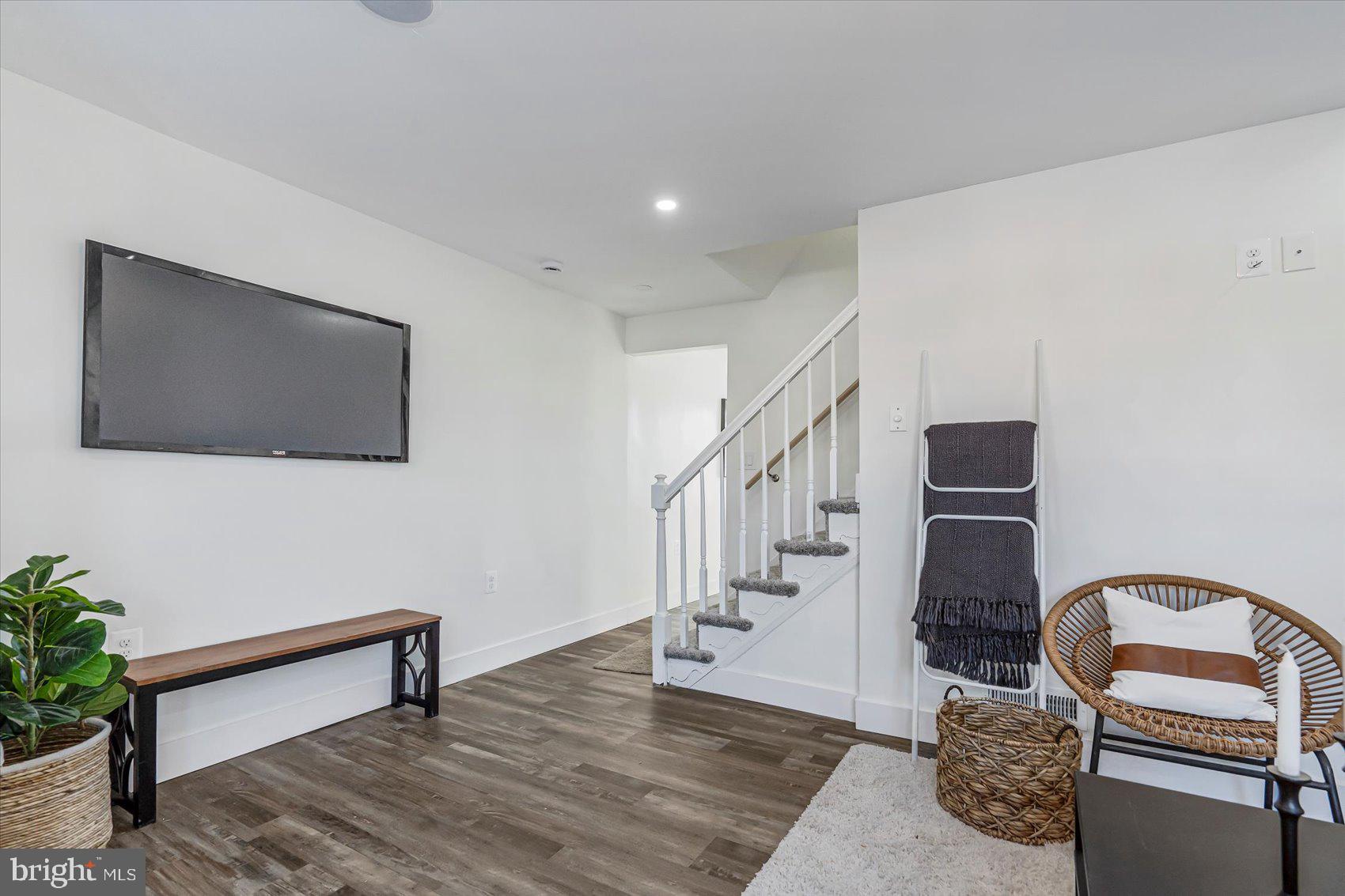 3925 Chesterfield Avenue Baltimore, MD 21213 - Photo 5 of 35 a living room with furniture and a flat screen tv
