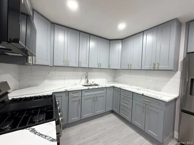a kitchen with a sink and cabinets
