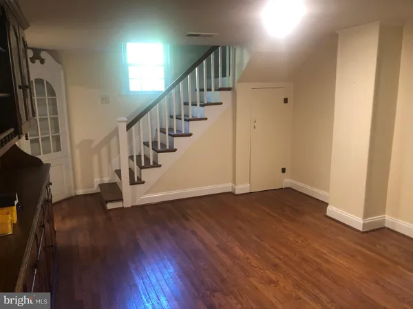 a view of an entryway with wooden floor