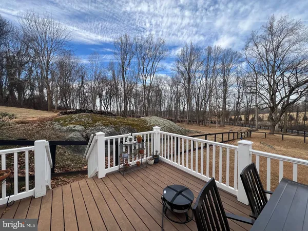 a view of a chairs on wooden deck