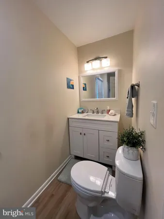 a bathroom with a sink toilet and mirror
