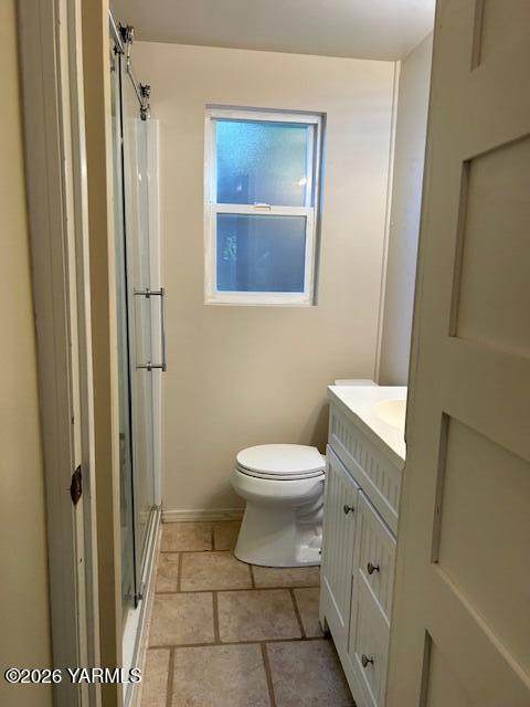 208 South 47th Avenue Yakima, WA 98908 - Photo 16 of 22 a bathroom with a toilet and a mirror