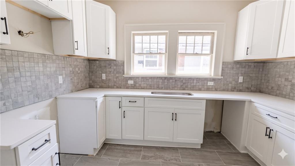 665 Lexington Avenue Southwest Atlanta, GA 30310 - Photo 4 of 33 a kitchen with a sink cabinets appliances and a window