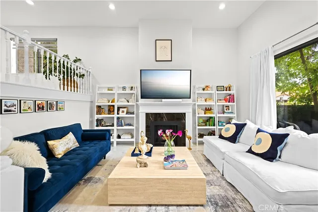 a living room with furniture and a fireplace