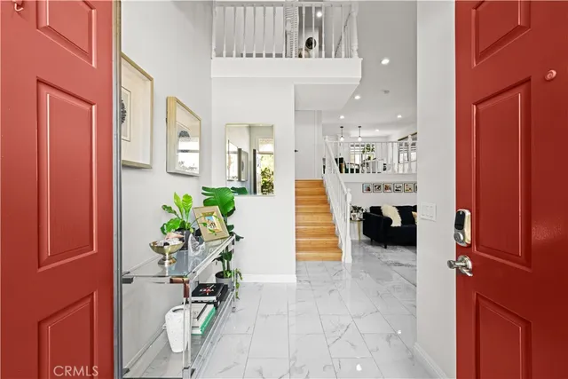 a view of storage and utility room with washer and dryer