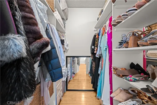 a bedroom with a bed and a lamp