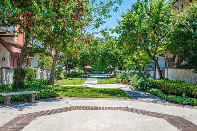 a view of a wooden door and a tree