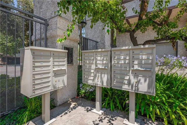 a park view with a bench and trees
