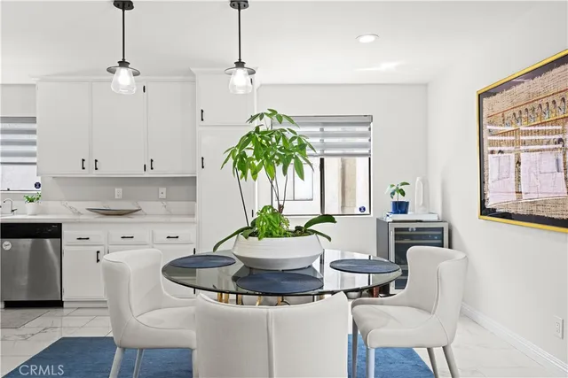 a kitchen with a table and chairs