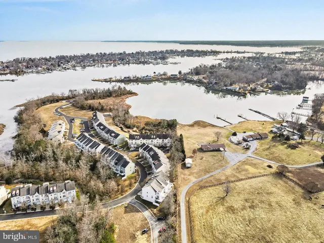 an aerial view of residential building and ocean