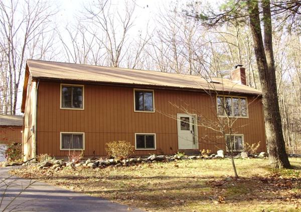 64 Squannacook Road Shirley, MA 01464 - Photo 1 of 13 a view of a house with snow on the road