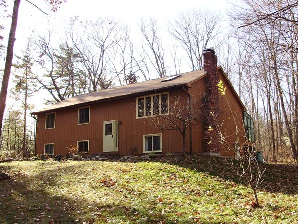 64 Squannacook Road Shirley, MA 01464 - Photo 13 of 13 a backyard of a house with large trees