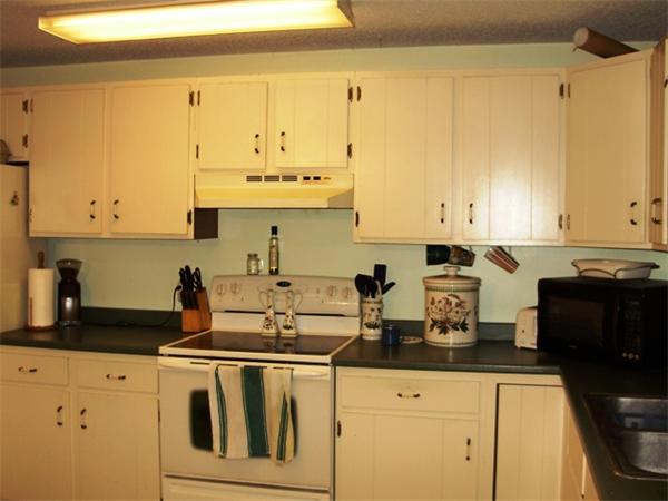 64 Squannacook Road Shirley, MA 01464 - Photo 6 of 13 a kitchen with stainless steel appliances granite countertop a sink and cabinets