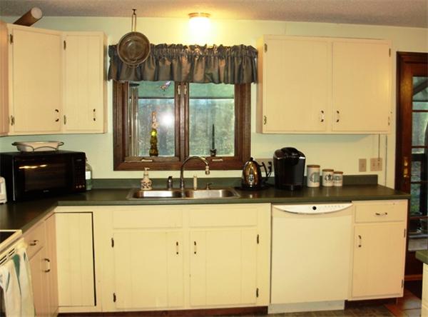 64 Squannacook Road Shirley, MA 01464 - Photo 7 of 13 a kitchen with a sink and cabinets