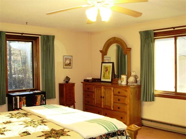 64 Squannacook Road Shirley, MA 01464 - Photo 8 of 13 a bedroom with a bed and a dresser